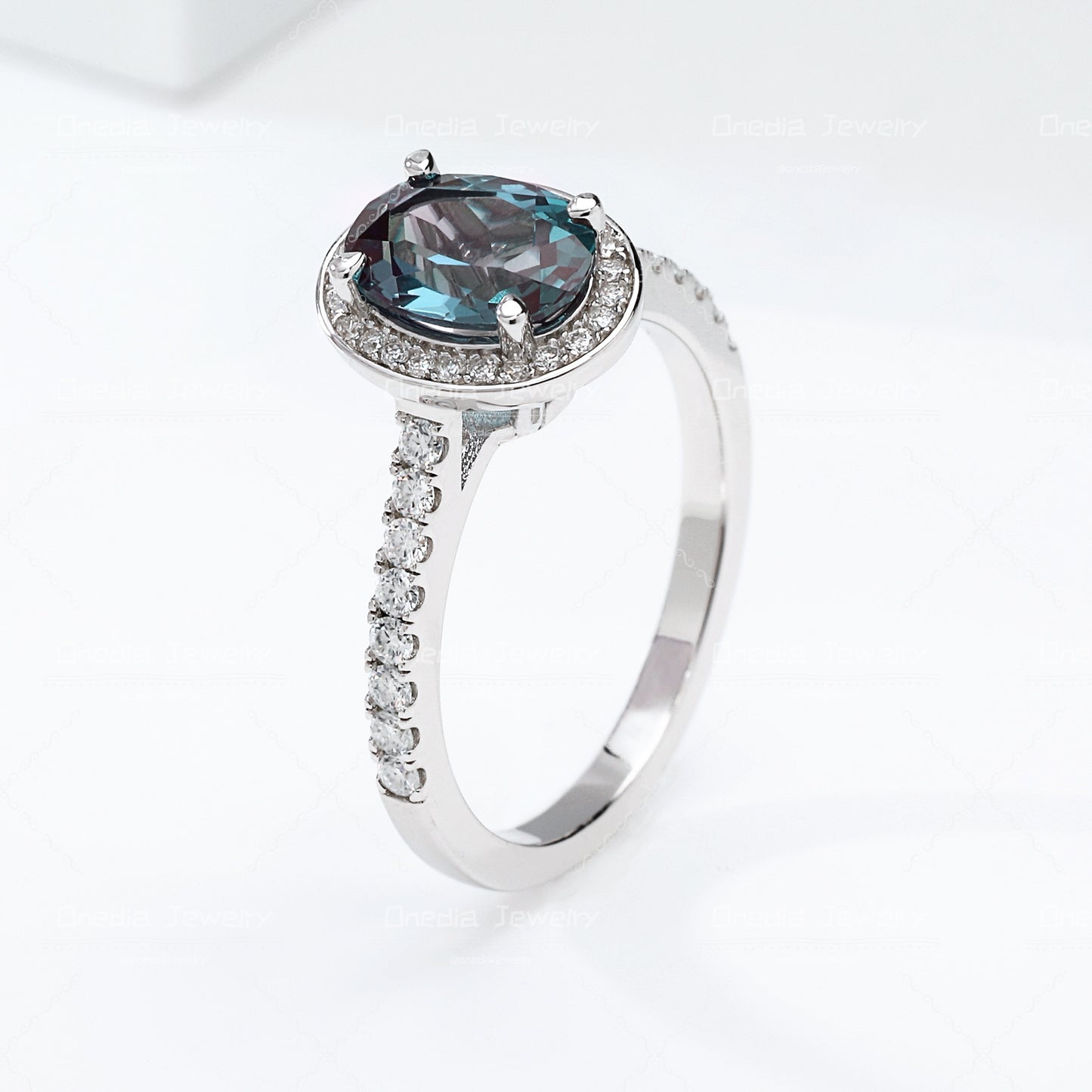 1.5ct Oval Lab Grown Alexandrite Teal color 6x8mm Classic Halo design Engagement ring in 18k white gold