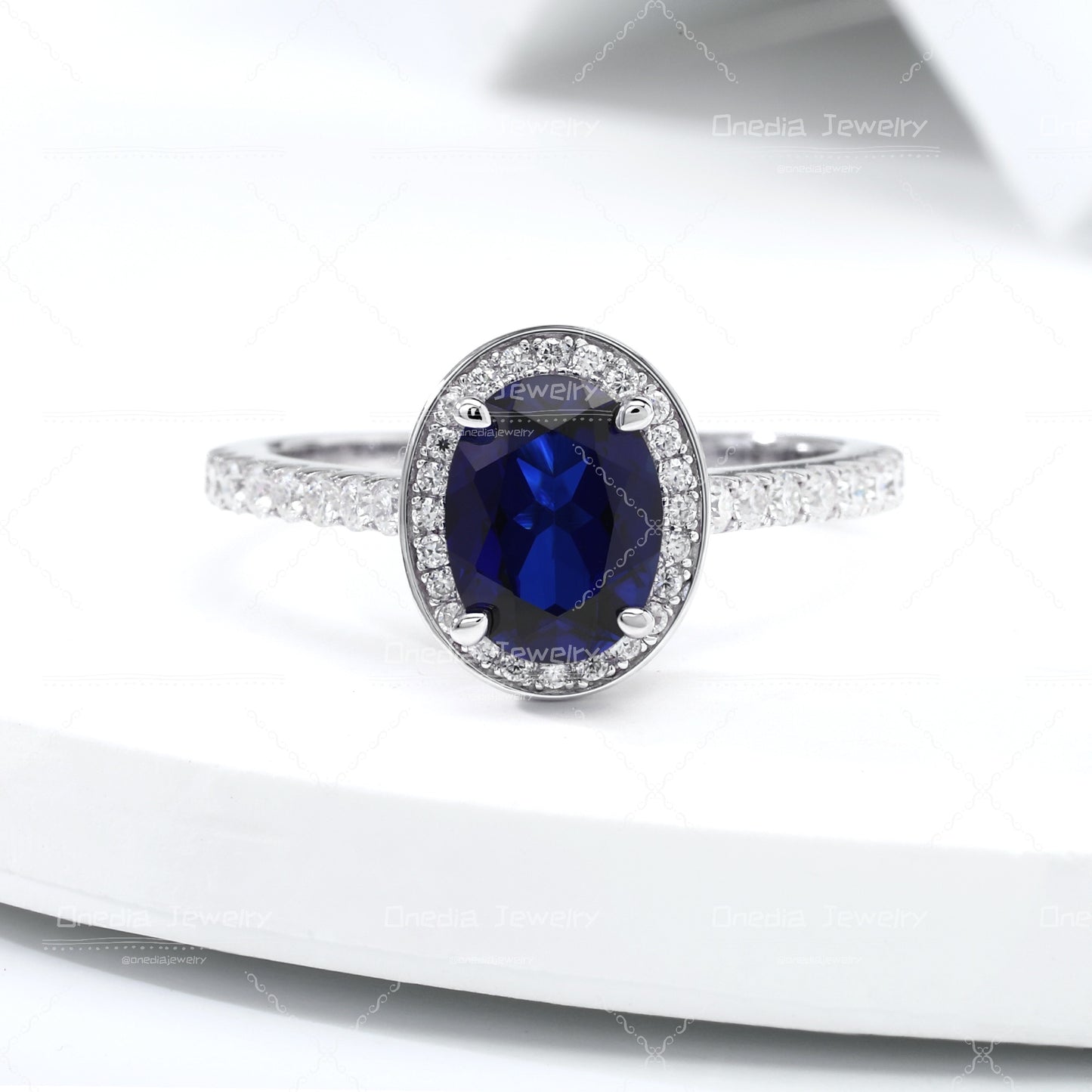 1.5ct Oval Lab Grown Sapphire Royal Blue 6x8mm Classic Halo design Engagement ring in 18k white gold