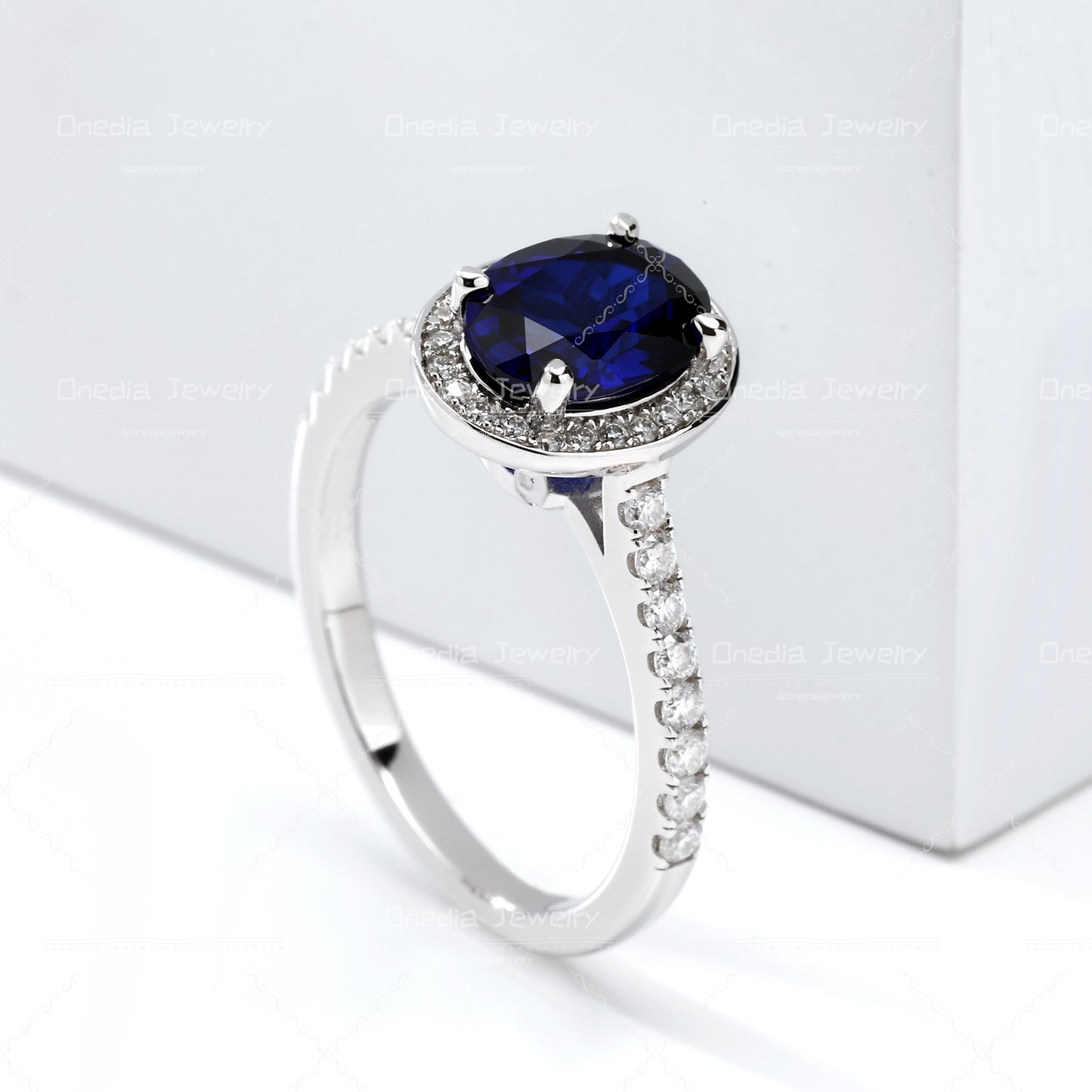 1.5ct Oval Lab Grown Sapphire Royal Blue 6x8mm Classic Halo design Engagement ring in 18k white gold