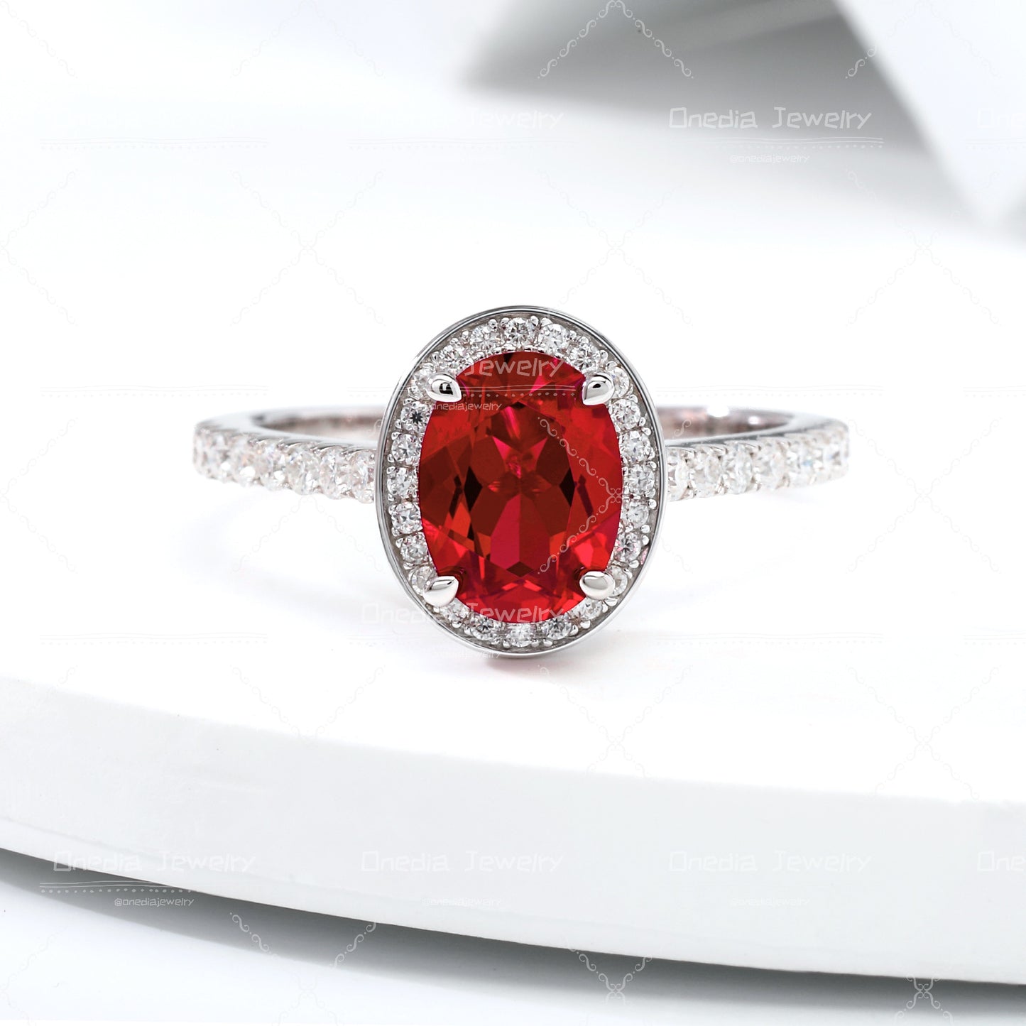 1.5ct Oval Lab Grown Sapphire Padparadscha 6x8mm Classic Halo design Engagement ring in 18k white gold
