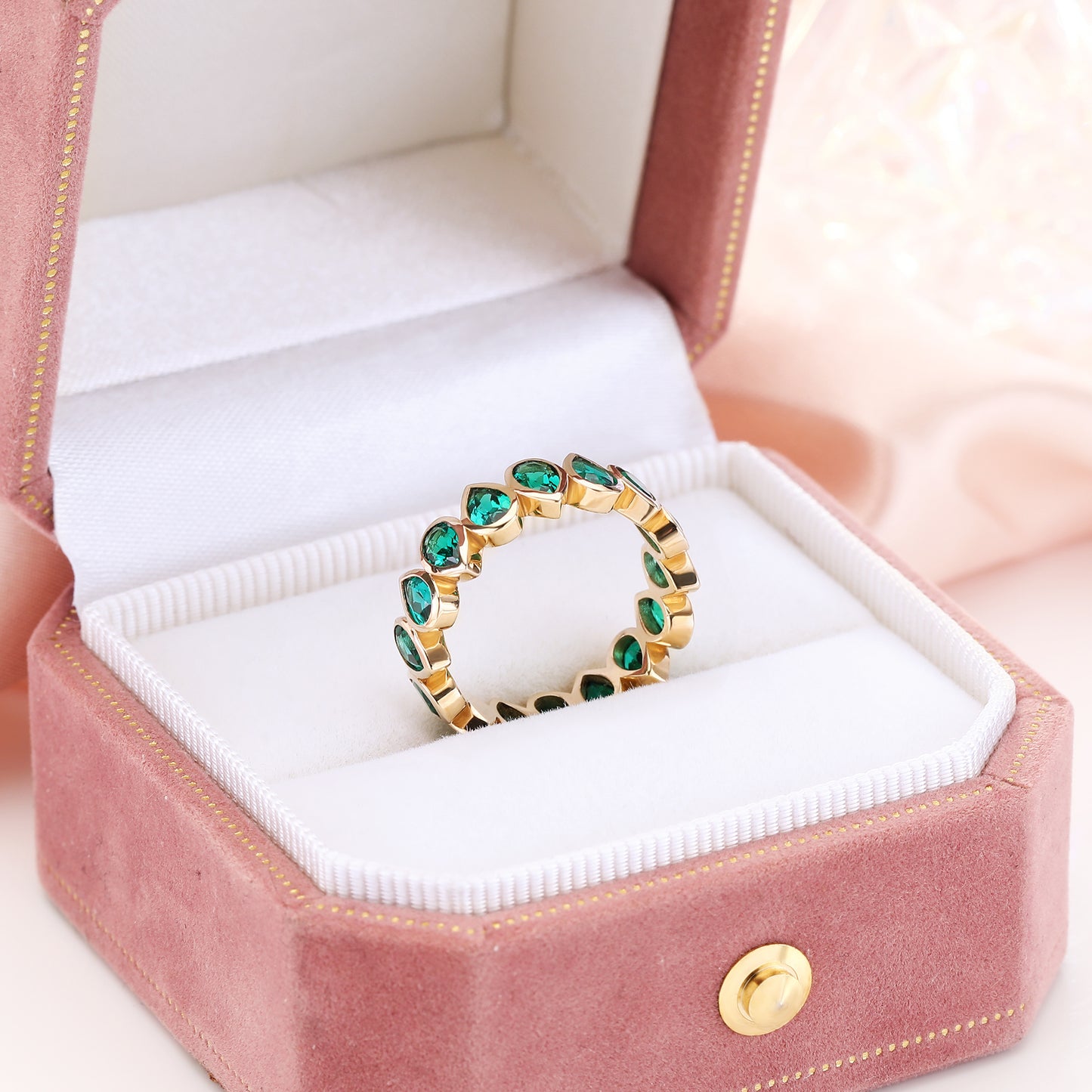Bezel set Lab Grown Emerald 3x5 pear shaped eternity band ring in gold