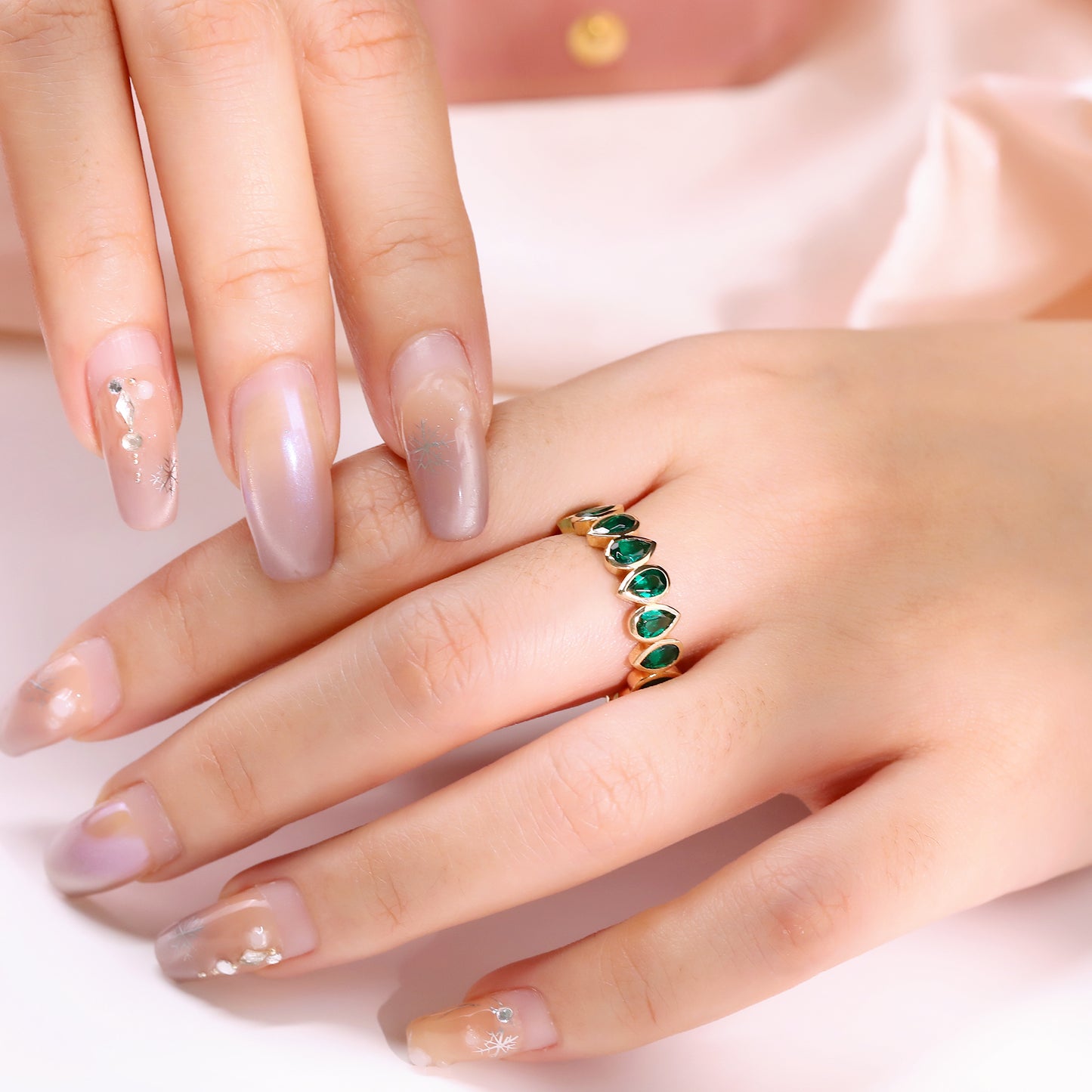 Bezel set Lab Grown Emerald 3x5 pear shaped eternity band ring in gold