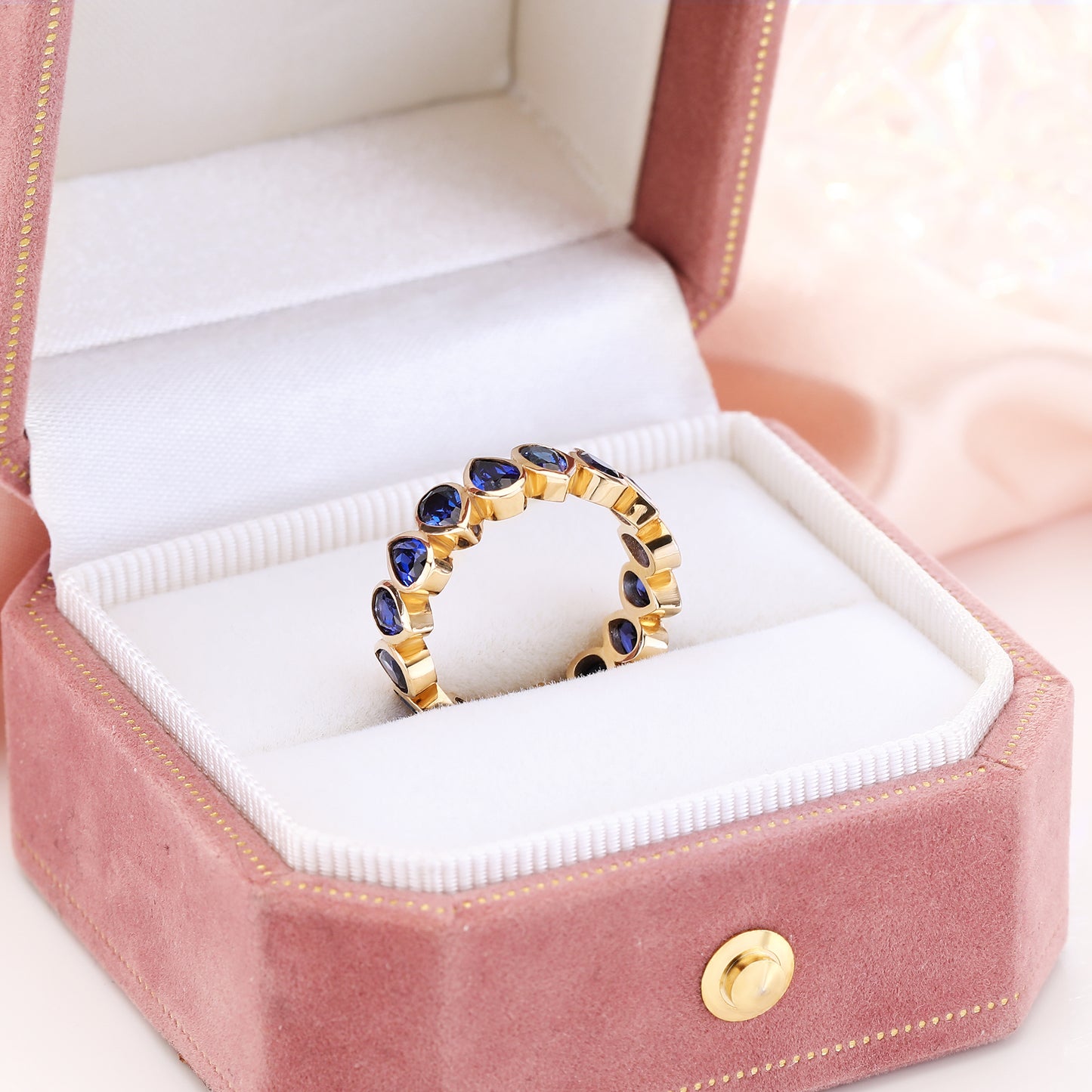 Bezel set Lab Grown Sapphire Royal Blue 3x5 pear shaped eternity band ring in gold