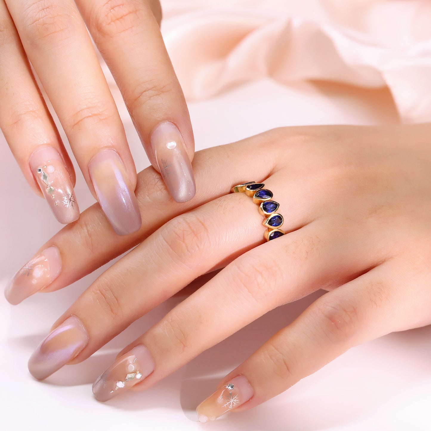 Bezel set Lab Grown Sapphire Royal Blue 3x5 pear shaped eternity band ring in gold