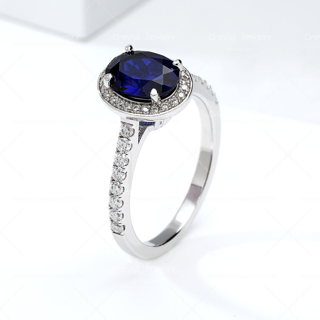 1.5ct Oval Lab Grown Sapphire Royal Blue 6x8mm Classic Halo design Engagement ring in 18k white gold