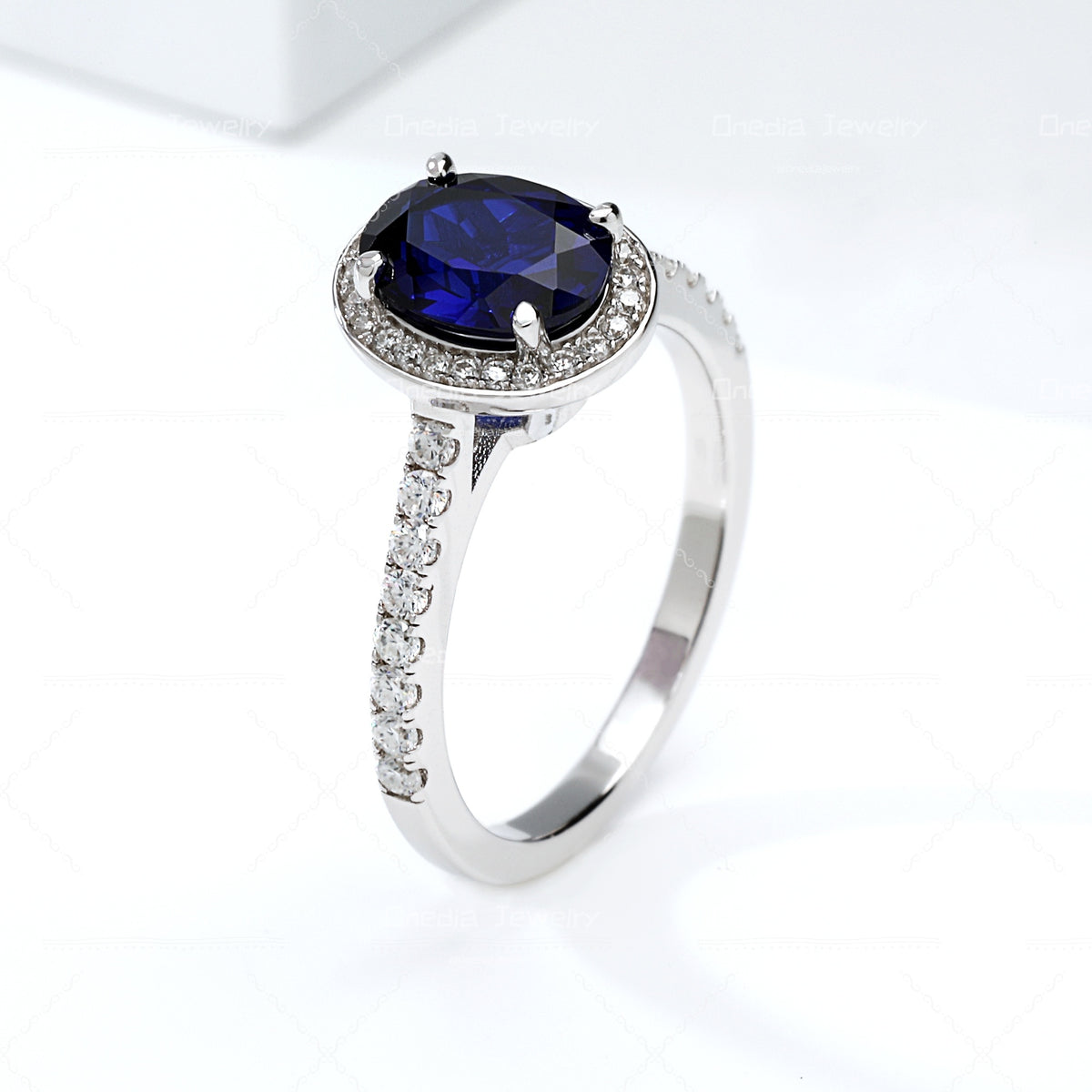 1.5ct Oval Lab Grown Sapphire Royal Blue 6x8mm Classic Halo design Engagement ring in 18k white gold