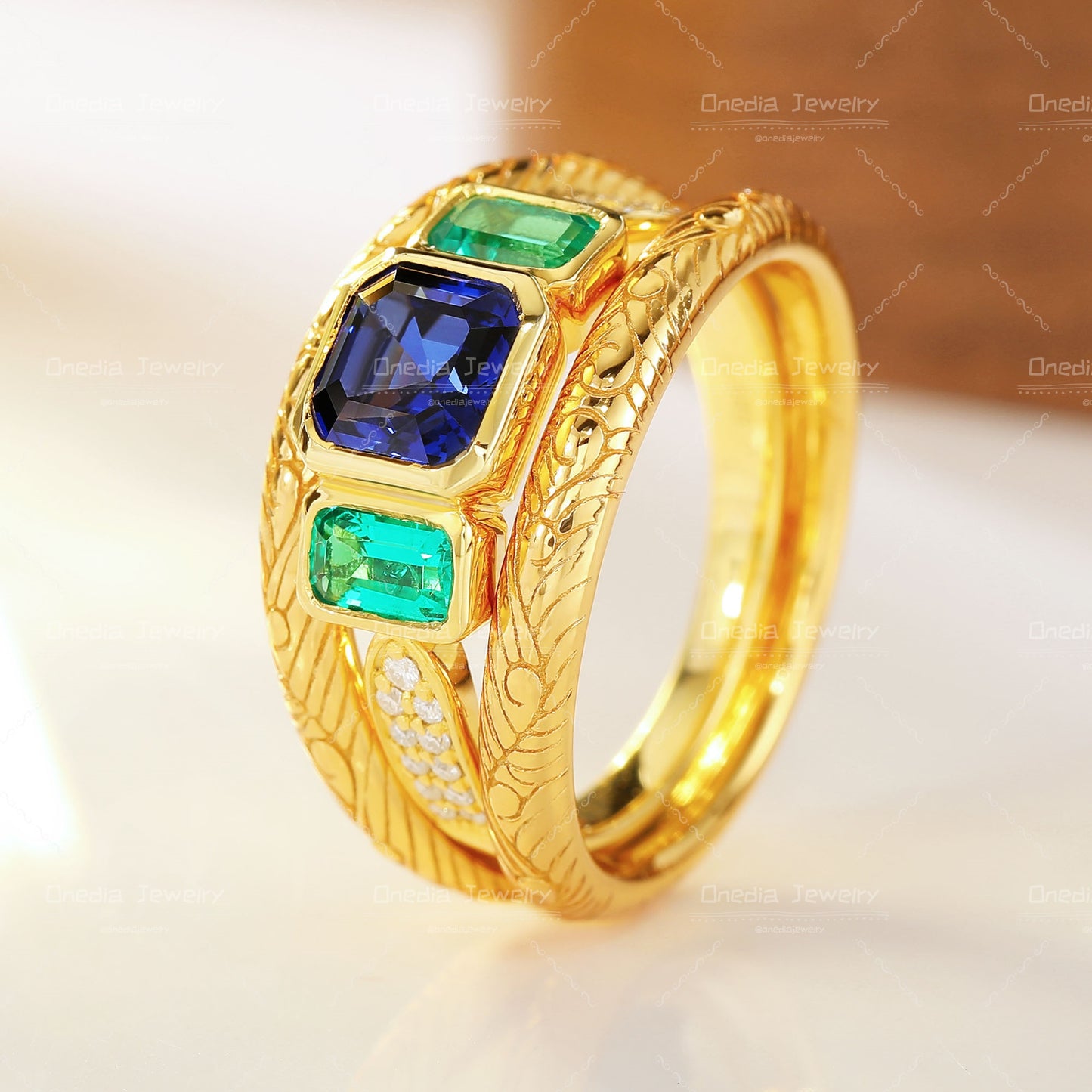 Three-Stone Emerald Cut Lab Grown Sapphire Ring with Matching Engraved Bands in 18K gold