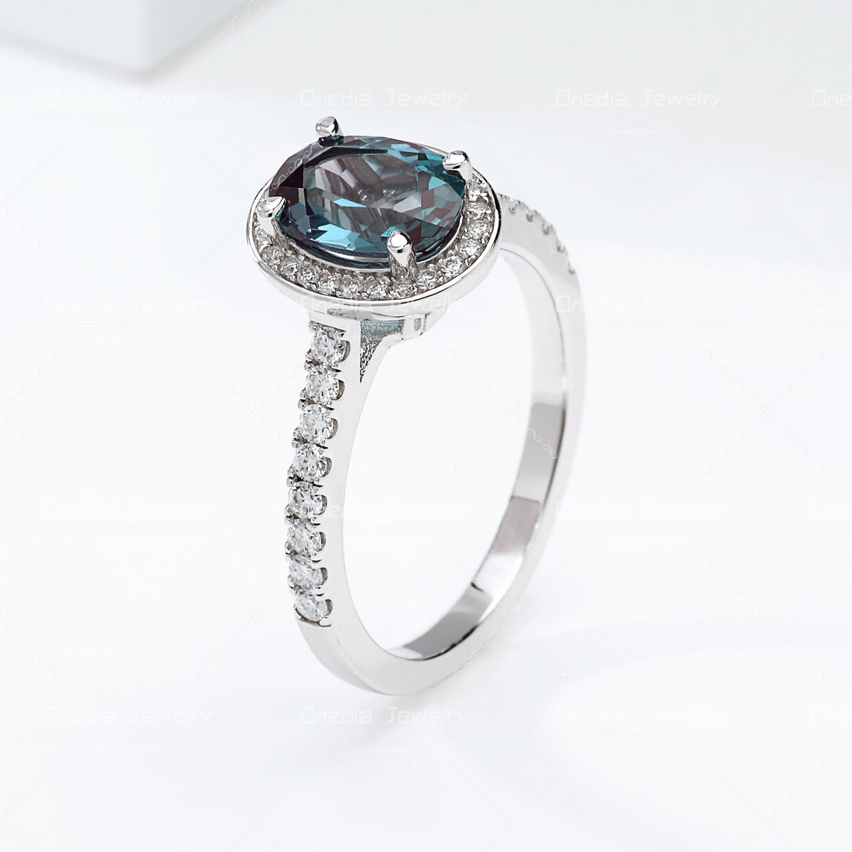 1.5ct Oval Lab Grown Alexandrite Teal color 6x8mm Classic Halo design Engagement ring in 18k white gold