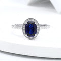 1.5ct Oval Lab Grown Sapphire Royal Blue 6x8mm Classic Halo design Engagement ring in 18k white gold