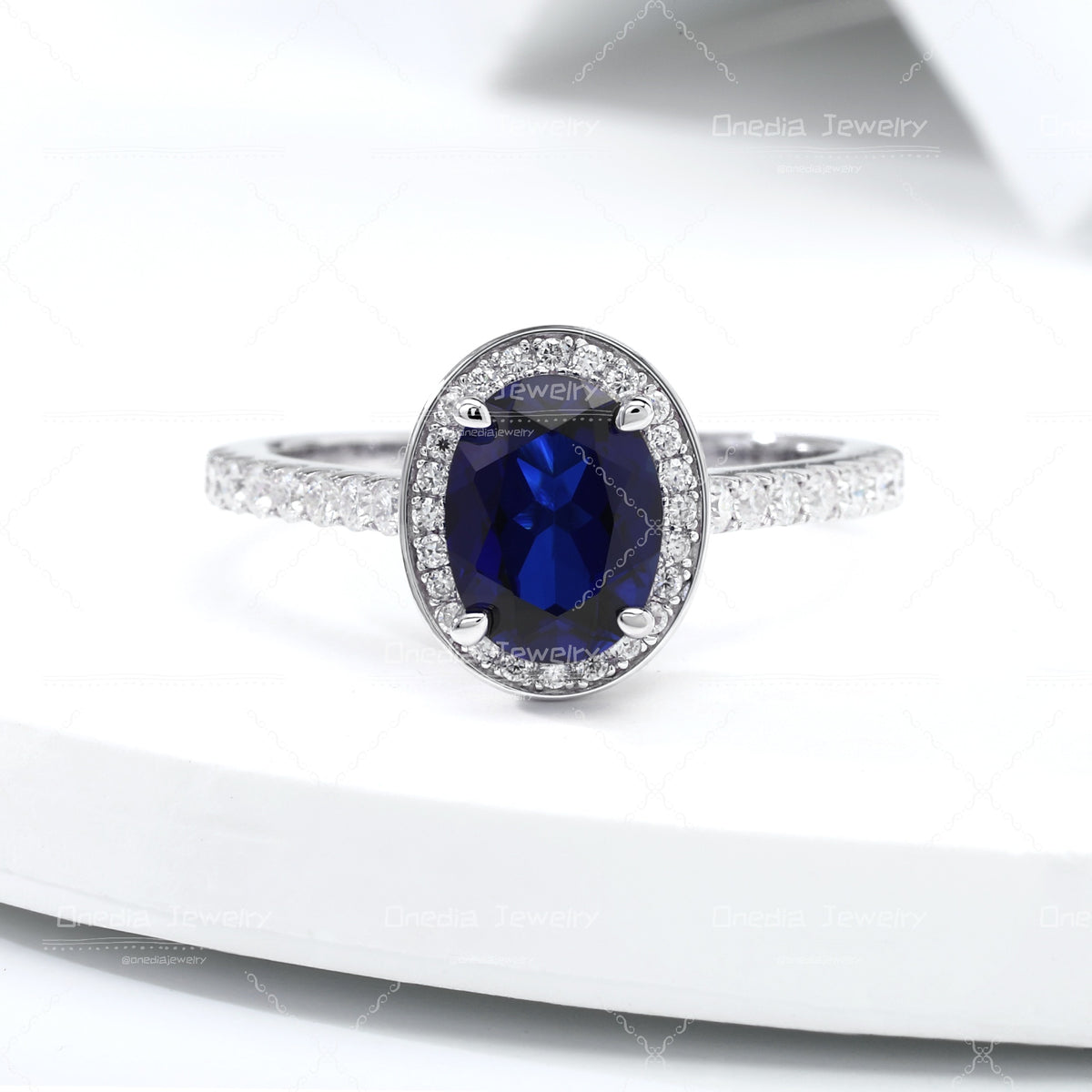 1.5ct Oval Lab Grown Sapphire Royal Blue 6x8mm Classic Halo design Engagement ring in 18k white gold