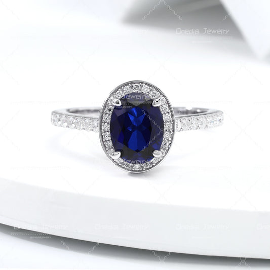 1.5ct Oval Lab Grown Sapphire Royal Blue 6x8mm Classic Halo design Engagement ring in 18k white gold