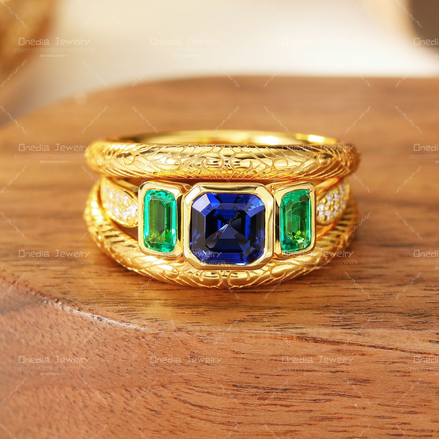 Three-Stone Emerald Cut Lab Grown Sapphire Ring with Matching Engraved Bands in 18K gold