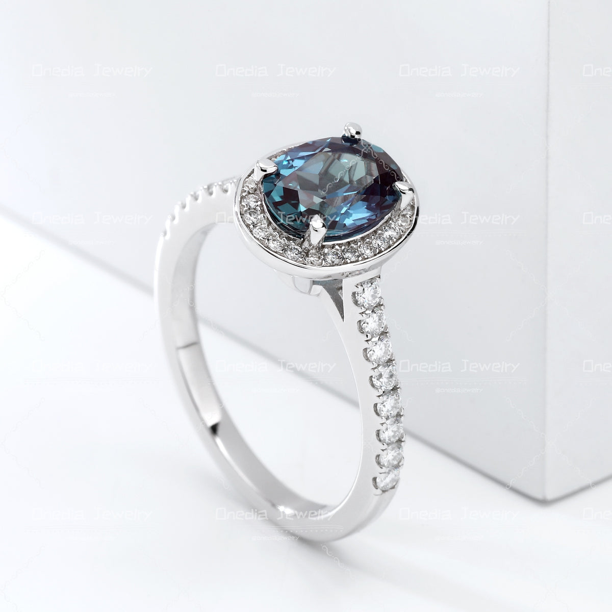 1.5ct Oval Lab Grown Alexandrite Teal color 6x8mm Classic Halo design Engagement ring in 18k white gold