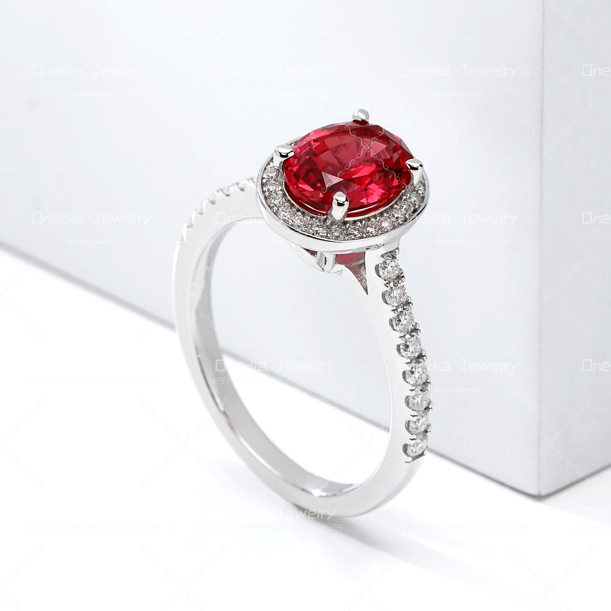 1.5ct Oval Lab Grown Sapphire Padparadscha 6x8mm Classic Halo design Engagement ring in 18k white gold